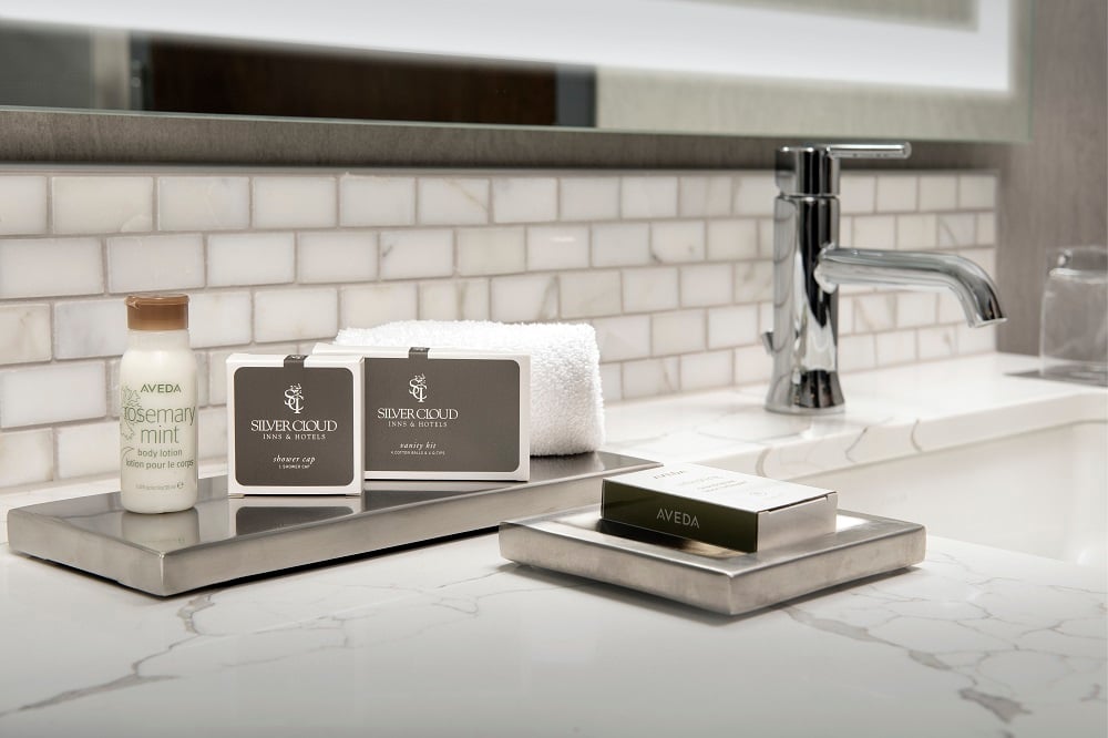 bathroom counter with amenities displayed
