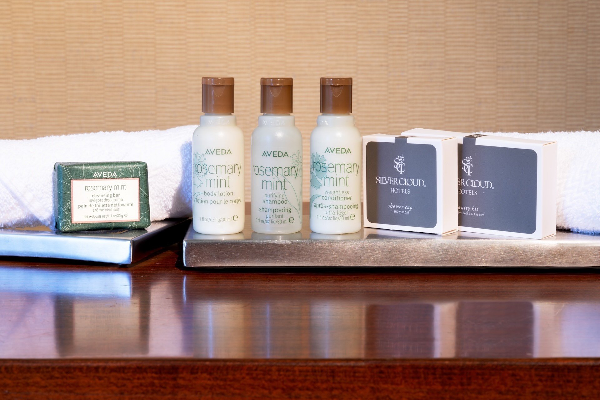 Aveda bathroom amenities, including soap, shampoo, and conditioner.