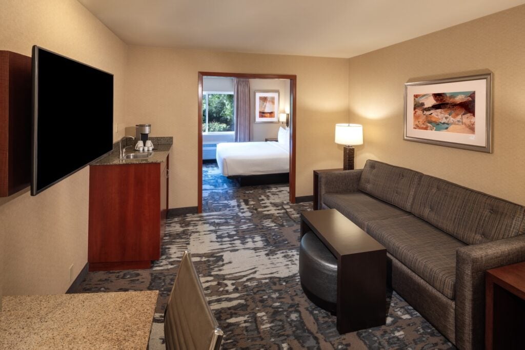 Seattle - University District King Mini-suite living space looking into bedroom with king bed.