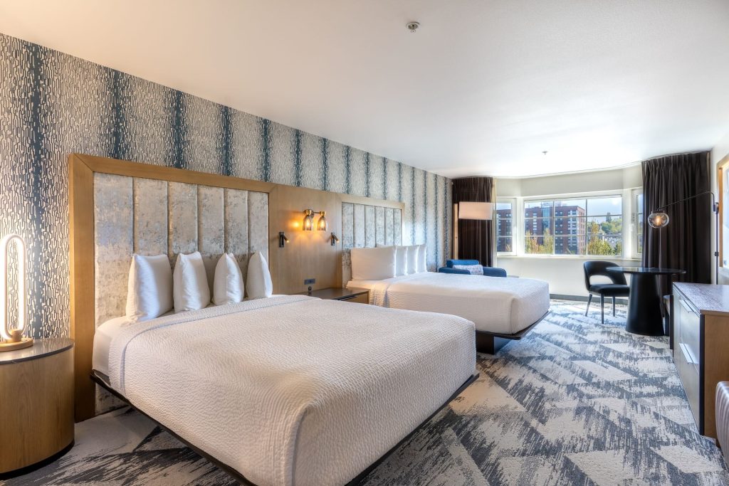 Beds in remodeled Double Queen guestroom at Silver Cloud Hotel - Seattle Broadway.
